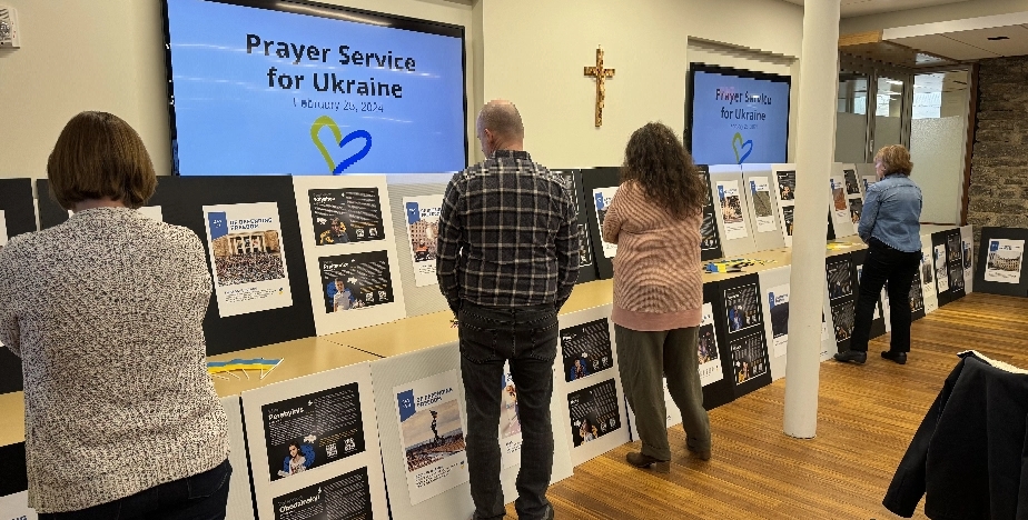 People viewing a display for the Ukraine service